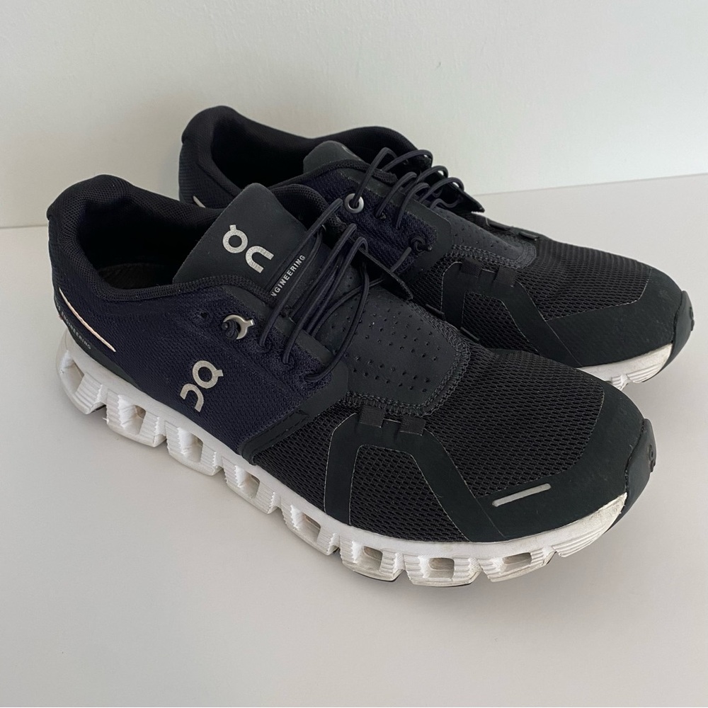 On running shoes black with white sole size 8.5